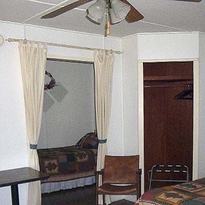 Twin Bed in curtained alcove