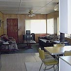 Spacious living room has double futon and large leather sofa
